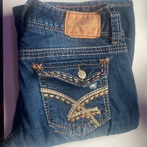 Amethyst Dark Boot Cut Low/Medium Rise Ripped Jean